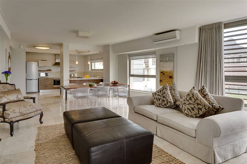 Large, spacious living area with balcony © SeaSky Villas