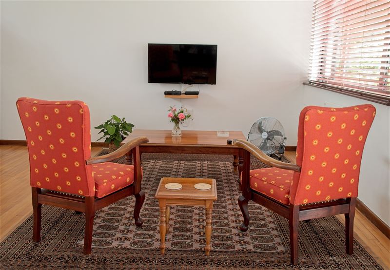 The living room has full Ds-Tv and Wi-fi. There is a wall heater and a portable fan. A printed user guide is also available.