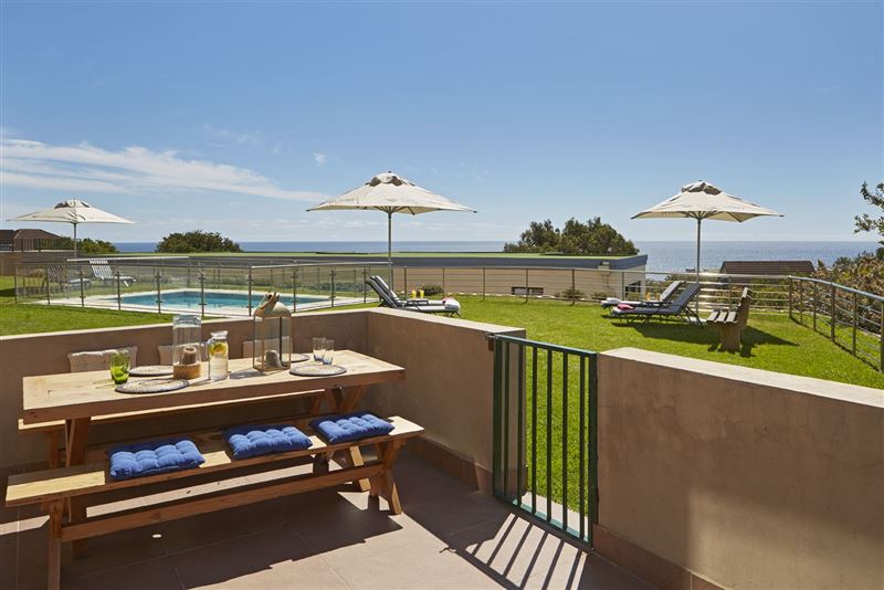 Private patio with outdoor dining and BBQ area