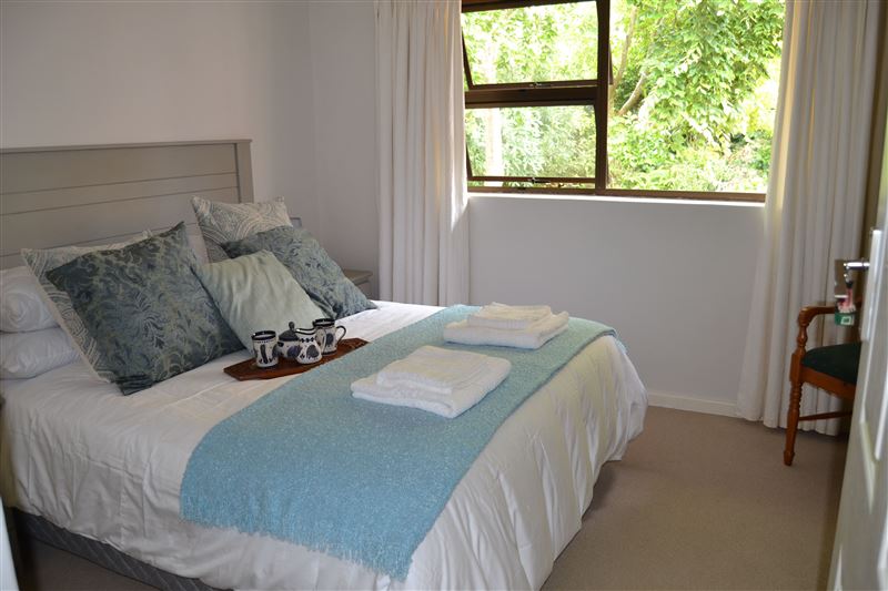 The Queen Garden View Room overlooks the garden and has a private bathroom.
