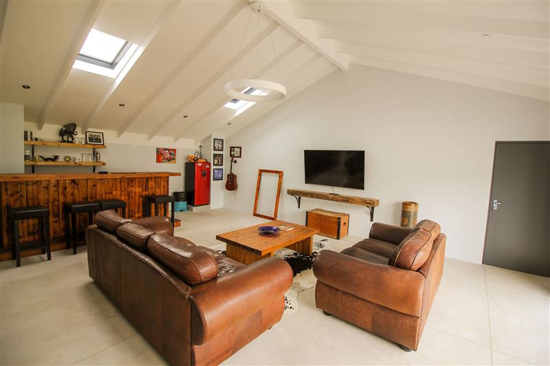 Spacious lounge with plasma TV