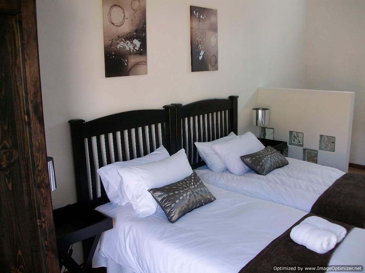 There is an en-suite bathroom with a shower, basin and toilet.